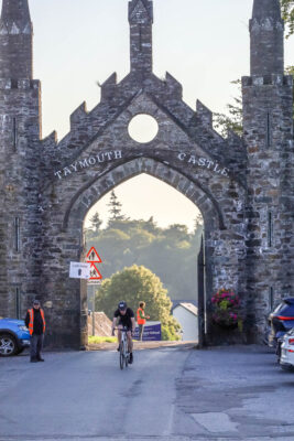 Cycling through the Taymouth Castle arch 